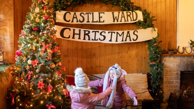 Visitors browsing locally crafted gifts at the Christmas market Castle Ward